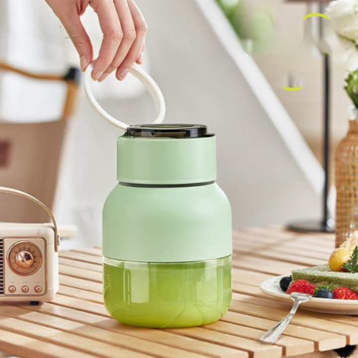 Green portable blender & juicer for smoothies. USB rechargeable personal smoothie maker for on-the-go healthy drinks.