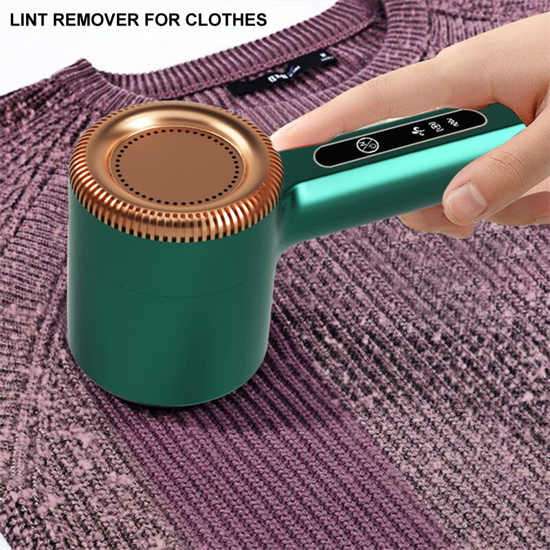 Compact green USB rechargeable lint remover, ideal travel accessory for garment care.