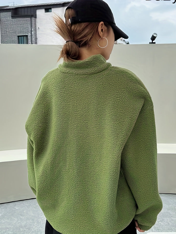 Soft beige women's casual sweatshirt featuring a zipper, offering warmth and relaxed comfort.
