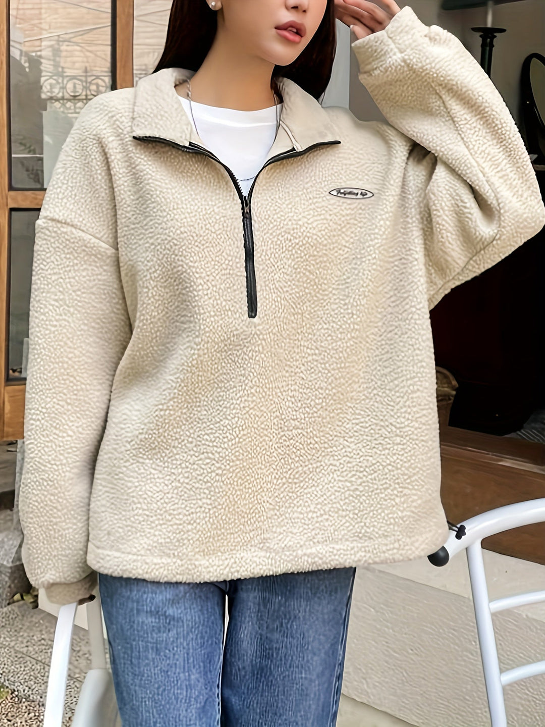 Green women's cozy long-sleeve pullover sweatshirt with zipper, excellent for layering and comfort.