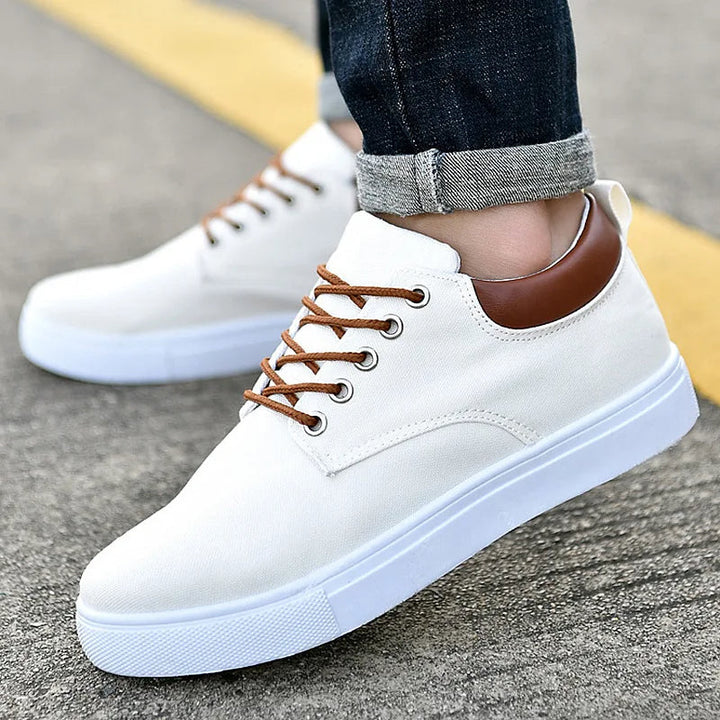 White Men's Monarch low-top sneakers, lace-up design for everyday comfort & modern casual men's fashion.