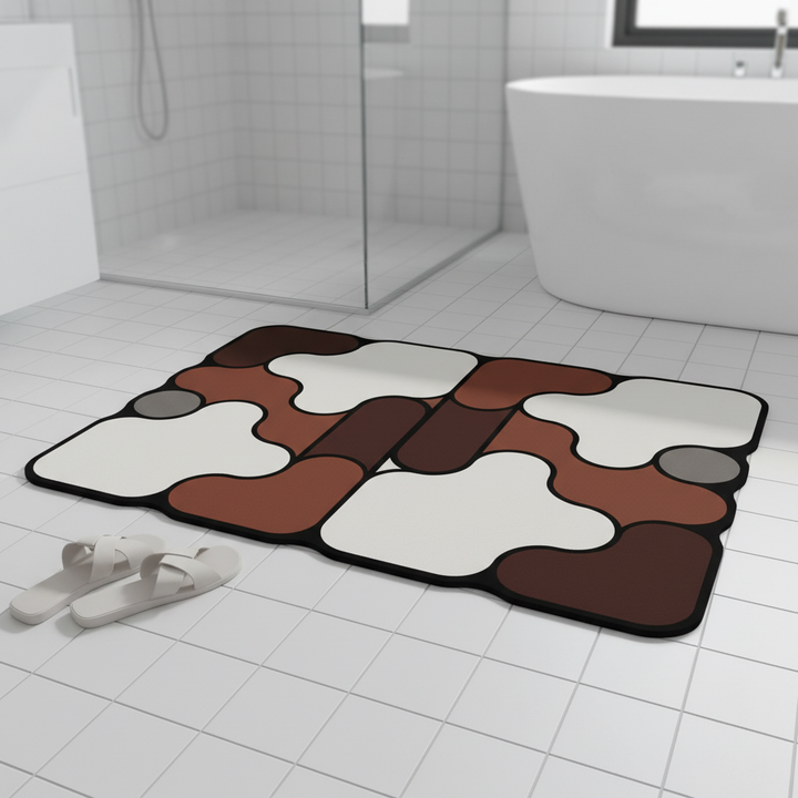 Grey padded knitted bath mat with diatomaceous earth for quick-dry bathroom comfort.
