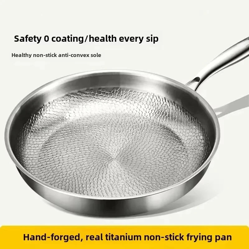 Induction-compatible non-stick skillet, featuring a unique hammered titanium surface for easy cleanup.