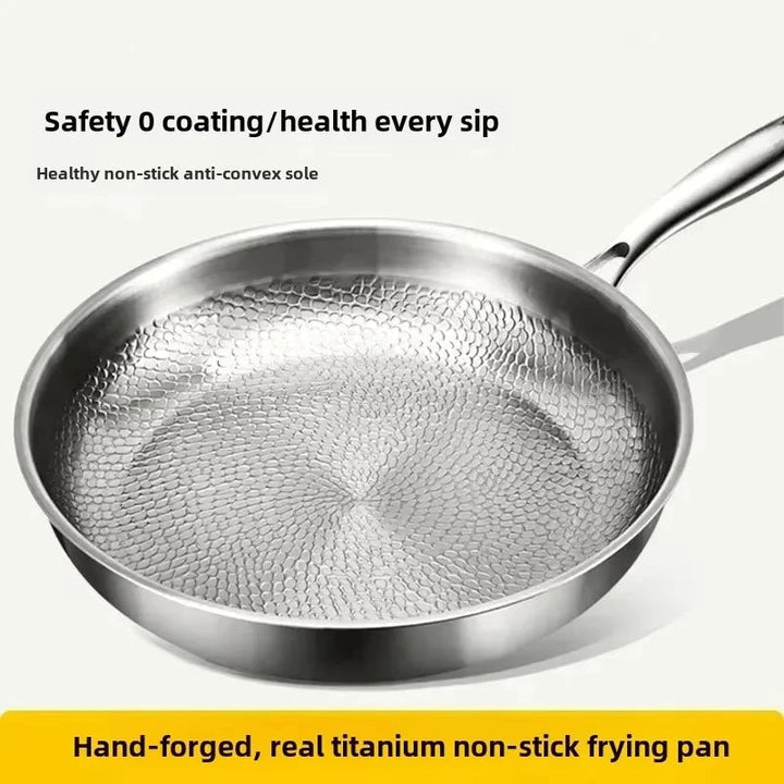 Induction-compatible non-stick skillet, featuring a unique hammered titanium surface for easy cleanup.