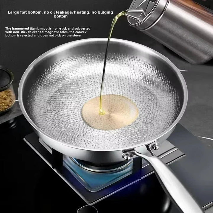 Close-up of hammered titanium texture on a non-stick frying pan, built for induction cooking.