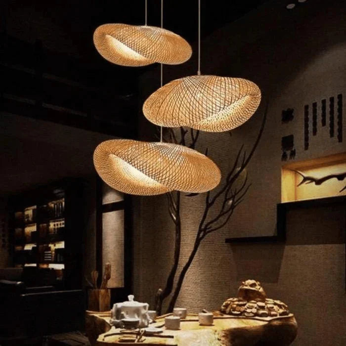 Close-up of intricate hand-woven rattan pendant light, highlighting natural texture. Eco-friendly woven fixture.