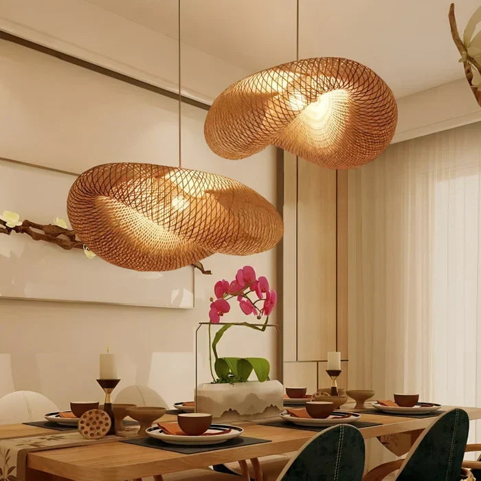 Large hand-woven rattan pendant light from below. Bohemian style ceiling fixture for natural home & garden decor.