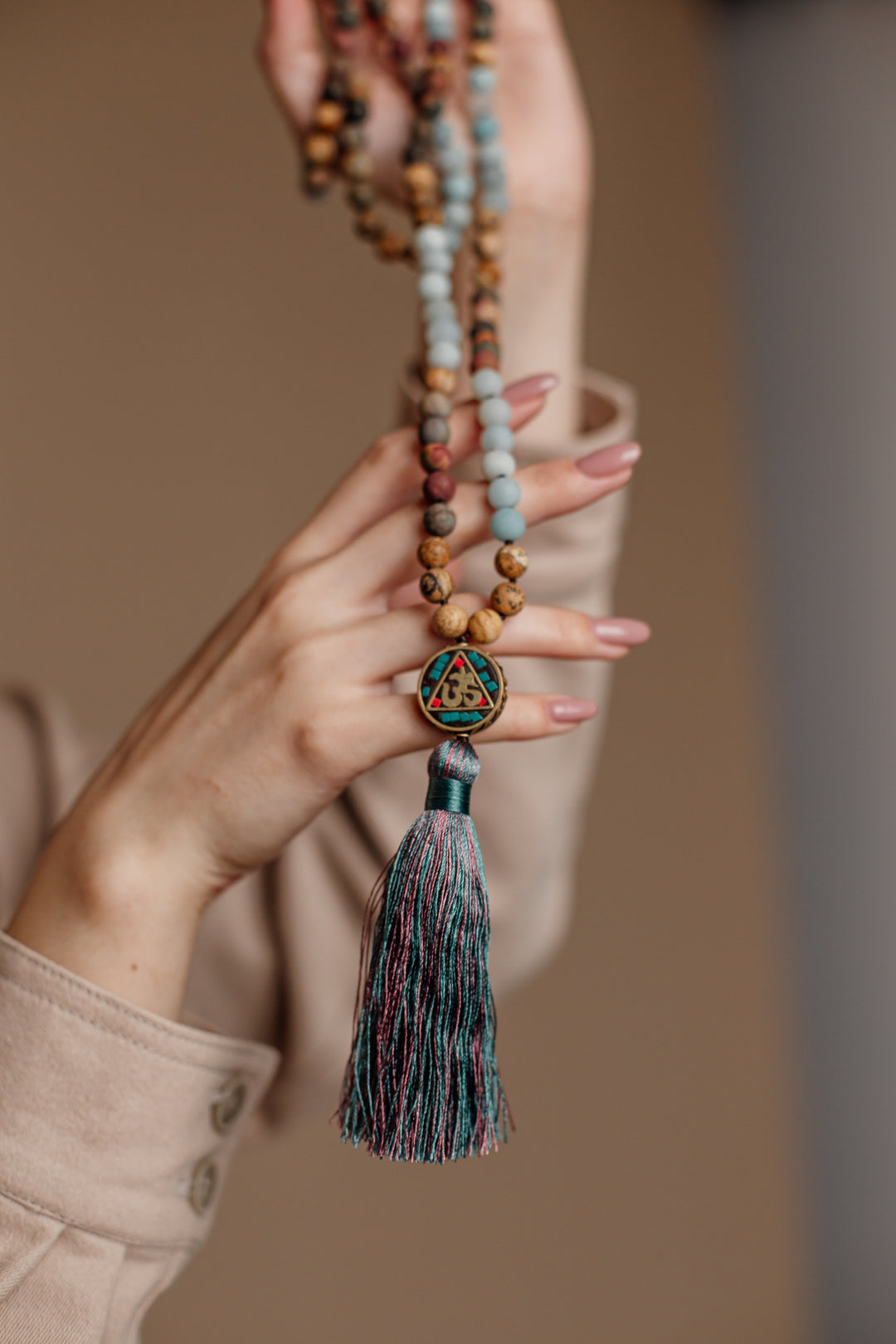 Spiritual Aum Mala bead necklace, handcrafted with natural Amazonite & Jasper. Unisex design for meditation & yoga.