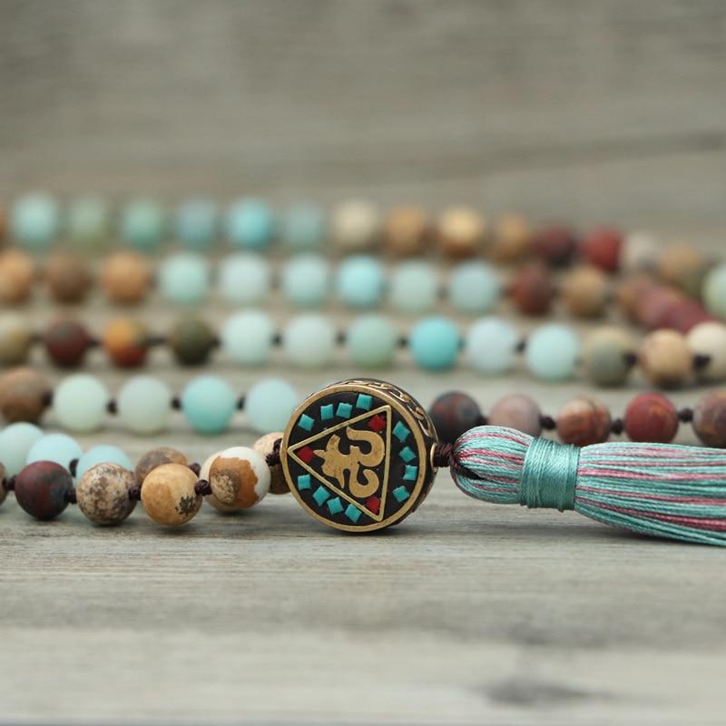 Unisex Anaya Aum Mala necklace for meditation. Features natural Amazonite & Jasper beads, spiritual yoga jewelry.