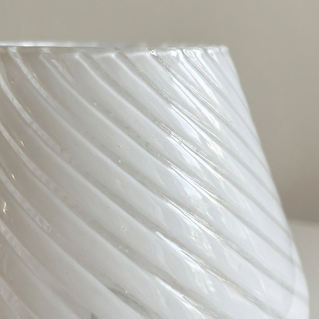 Close-up of a handcrafted Vellumo table lamp, showcasing unique Murano glass and artisan details