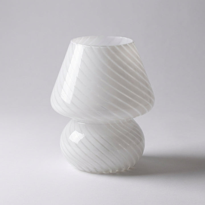 Tabletop view of a stylish Vellumo accent lamp, handcrafted with premium Murano glass for ambient lighting