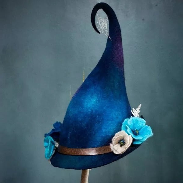 Women's black felt witch hat, handcrafted for Halloween costumes. Durable merino wool, perfect party accessory.