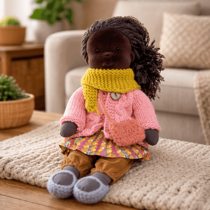 Simple yet engaging cotton Waldorf doll, promoting open-ended creative play for children.