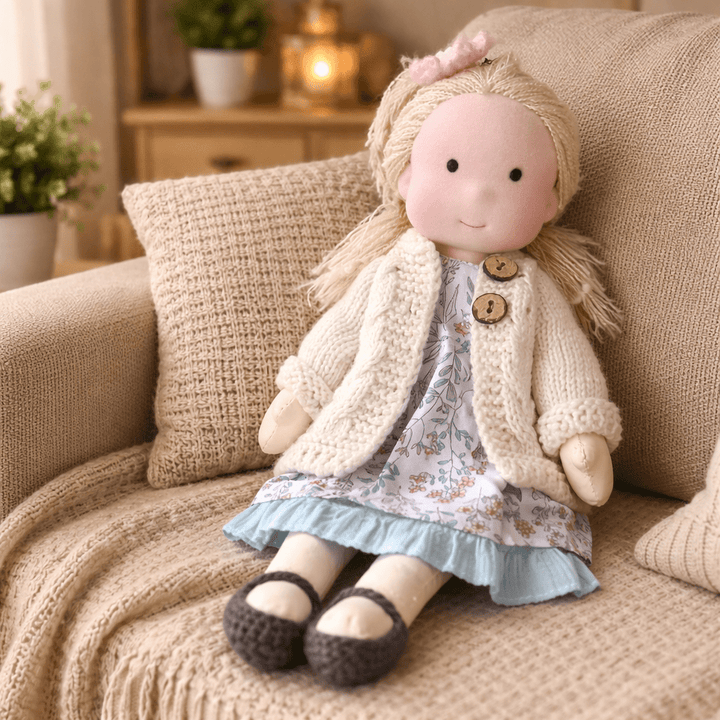 Waldorf doll with neutral expression, crafted from cotton for diverse imaginative play.