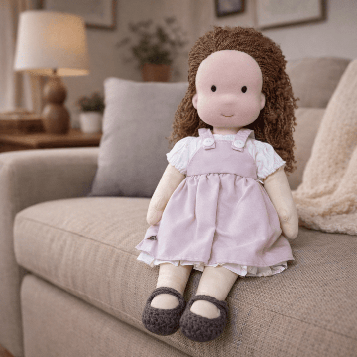Cotton Waldorf doll smiling gently, inviting kids into a world of imaginative play.