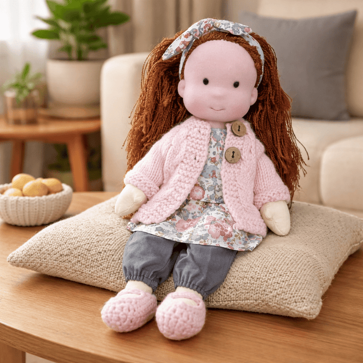 Thoughtfully crafted cotton Waldorf doll, ideal for imaginative play and development.