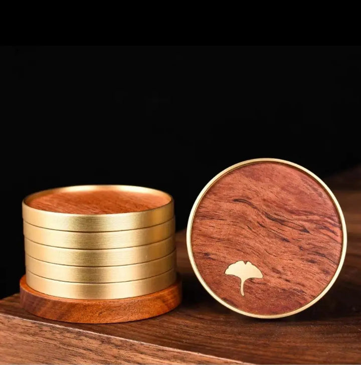 Handcrafted ginkgo leaf wood coasters for elegant home decor and table protection.