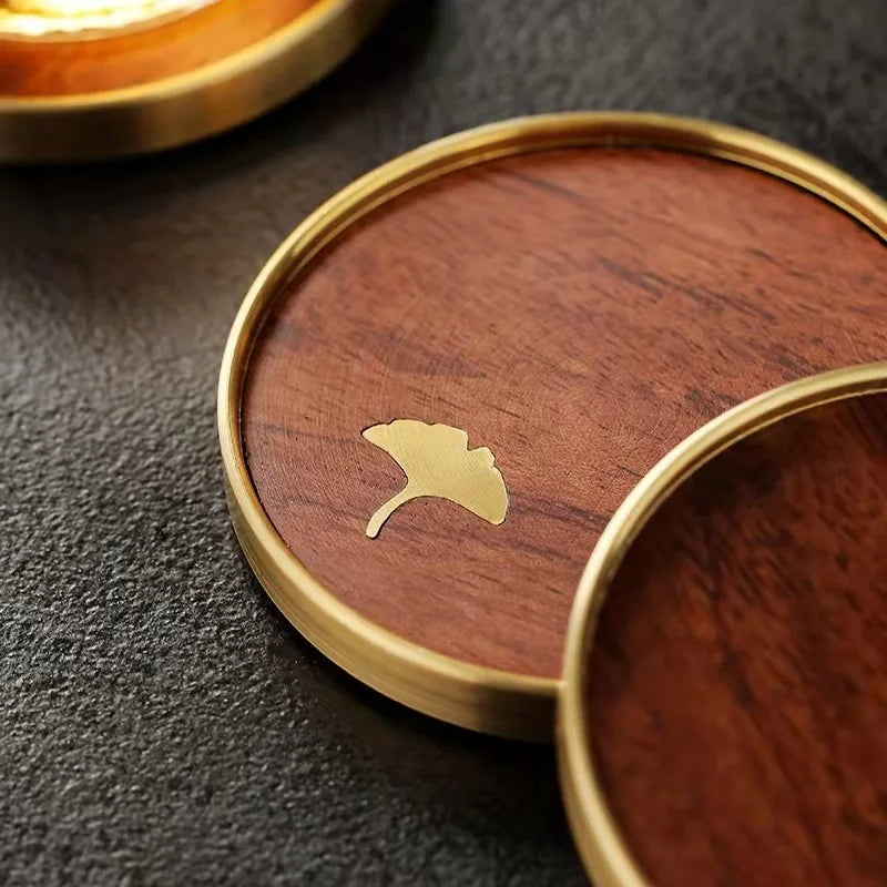 Elegant ebony ginkgo leaf wood coasters, a beautiful handcrafted home decor gift.