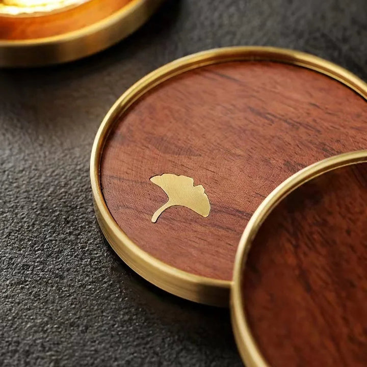 Elegant ebony ginkgo leaf wood coasters, a beautiful handcrafted home decor gift.