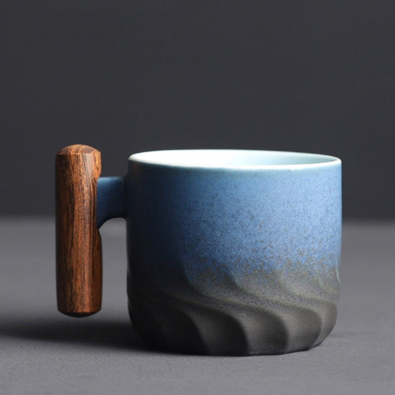Retrograde ceramic espresso mug, handcrafted with a unique wooden handle. Perfect for vintage kitchenware.