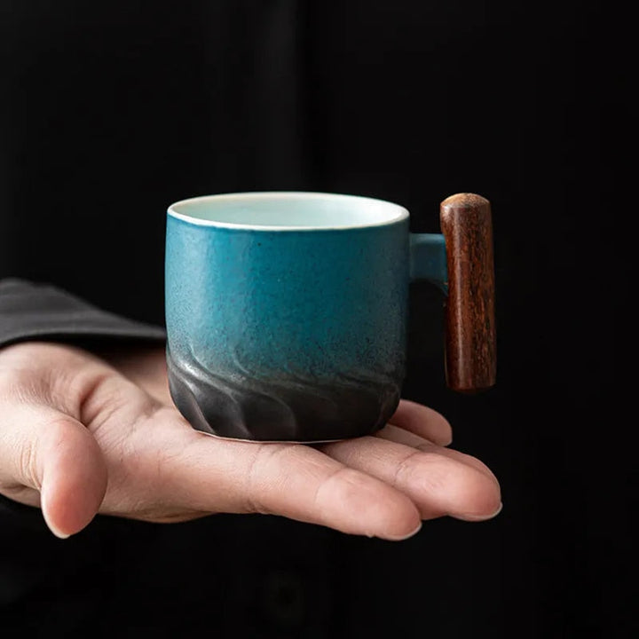 Mini Retrograde handcrafted ceramic coffee mug for espresso or tea, featuring a retro design & wooden handle.