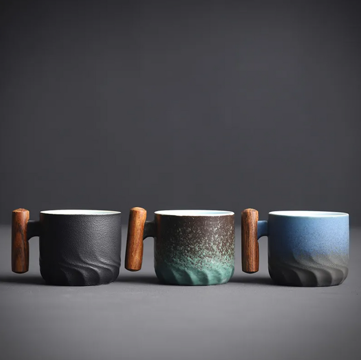 Handmade ceramic coffee mug, Mini Retrograde design, with a natural wooden handle. Great for artisan beverages.