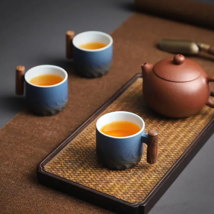 Retrograde ceramic mug, handcrafted for coffee or tea. Features a unique retro design & comfortable wooden handle.