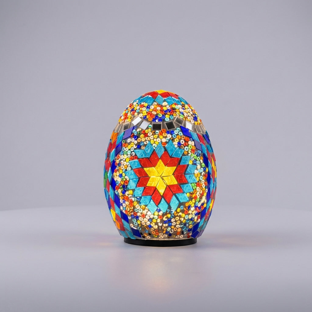 Closeup of a unique unisex mosaic egg lamp, battery operated table light with intricate patterns for bohemian decor.