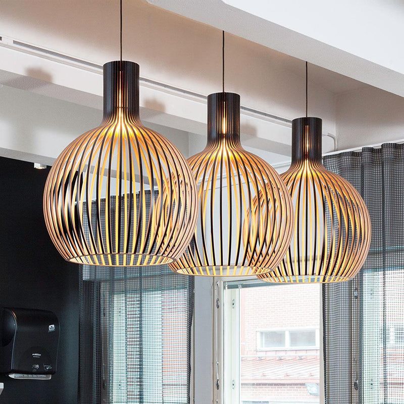 Modern natural wood pendant lamp, a handcrafted ceiling light enhancing rustic home decor.