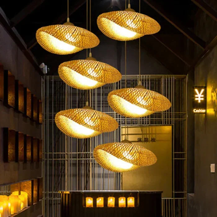 Boho rattan pendant light. Woven design provides natural lighting, perfect for rustic or tropical home decor.