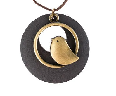 Unique wooden bird pendant necklace, handcrafted ethnic jewelry, perfect fashion accessory for women.