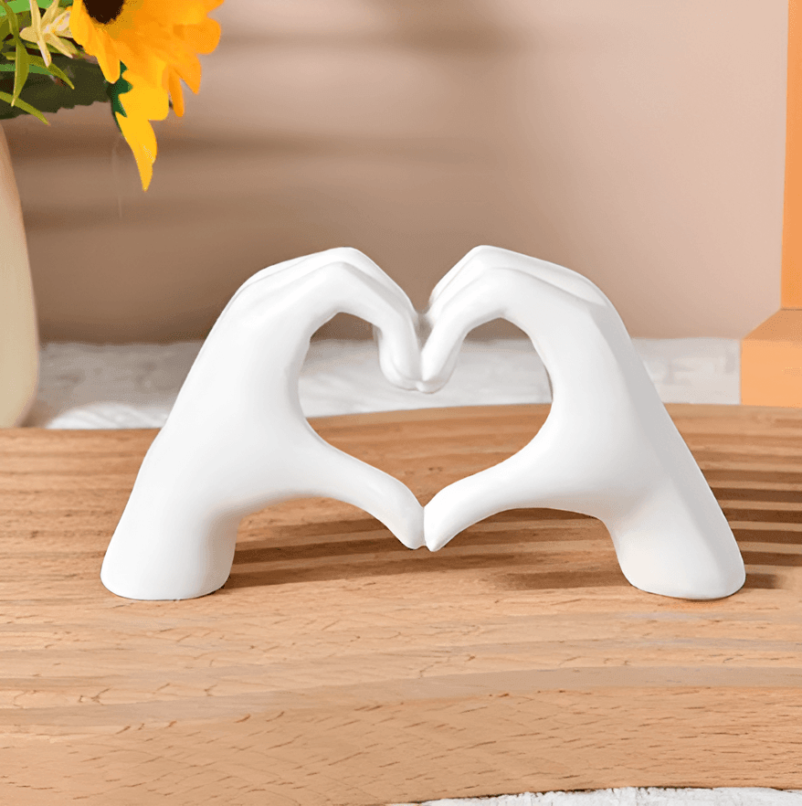 Beautiful wooden art piece depicting heart hands, a timeless love symbol for exquisite home decor.