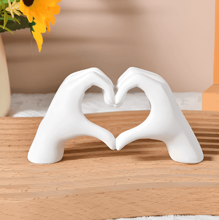 Beautiful wooden art piece depicting heart hands, a timeless love symbol for exquisite home decor.
