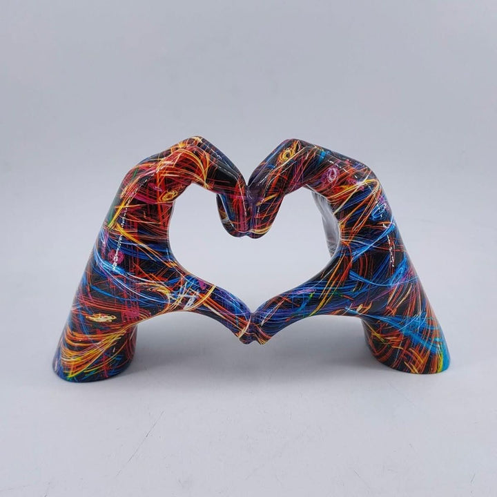 Decorative wood heart hands sculpture, a rustic love symbol home decor piece, ideal for tabletops.