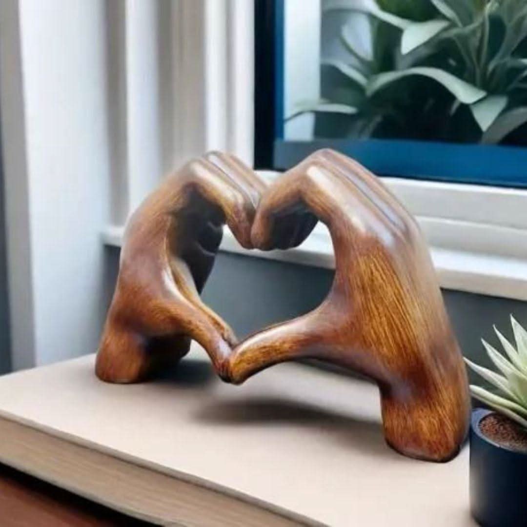 Artisanal wood heart hands sculpture, a handcrafted love symbol and unique wooden art home decor gift.