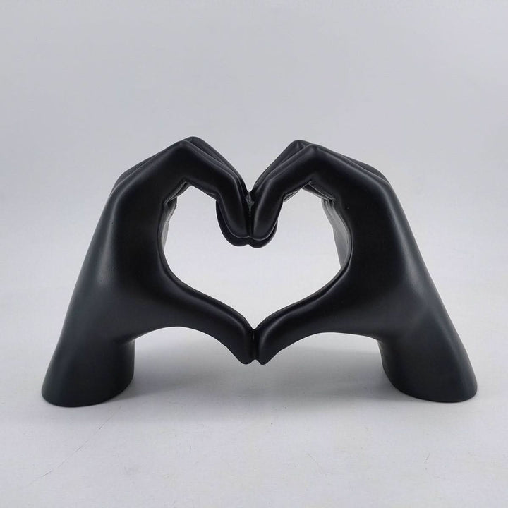 Charming wooden heart hands sculpture, a touching love symbol and decorative home art piece.