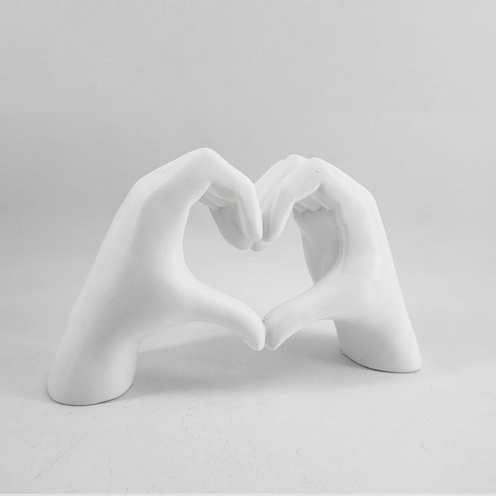 Smooth wooden heart hands sculpture, handcrafted artisanal decor, a beautiful living room accent.