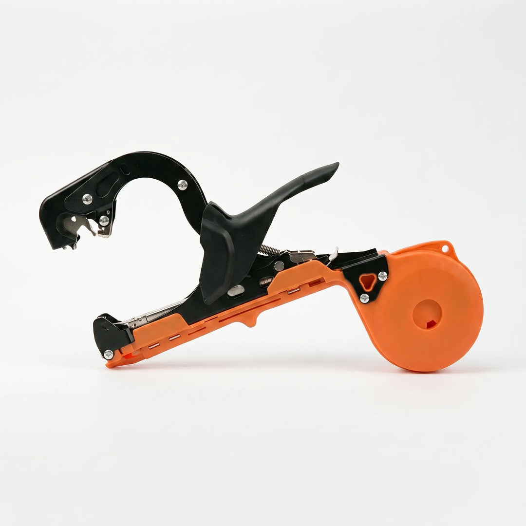 Close-up of manual garden plant tying tool, ideal for vine fastening and stem support in gardens.