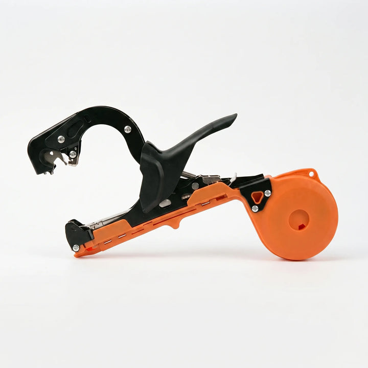Close-up of manual garden plant tying tool, ideal for vine fastening and stem support in gardens.