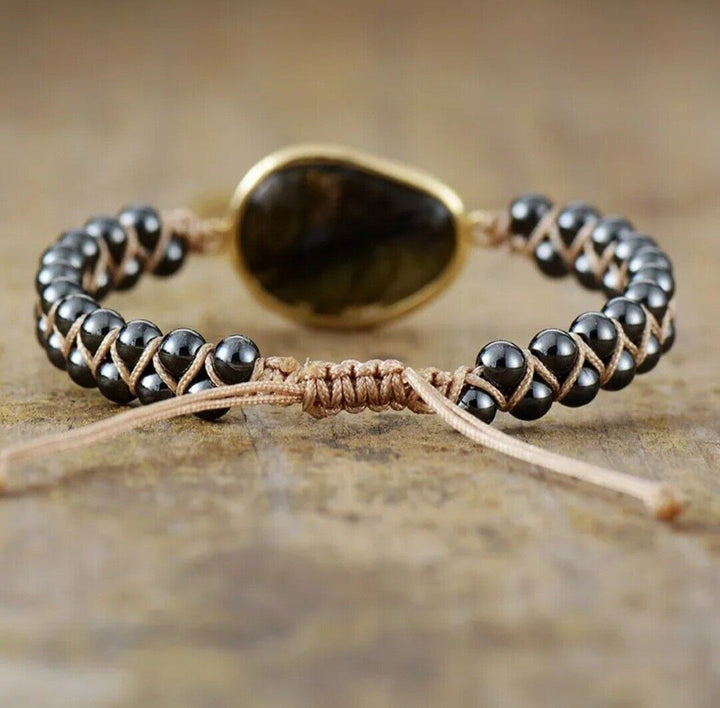 Adjustable natural stone braided cuff bracelet for mindful style, handmade with dark onyx & hematite beads.