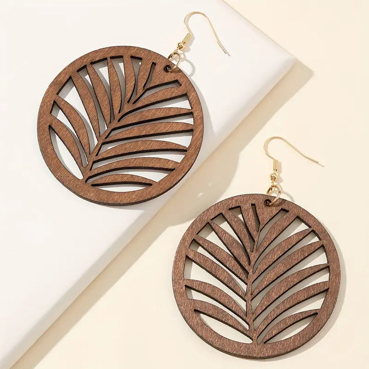 Handmade retro carved wooden dangle earrings for women, unique vintage style fashion accessory.