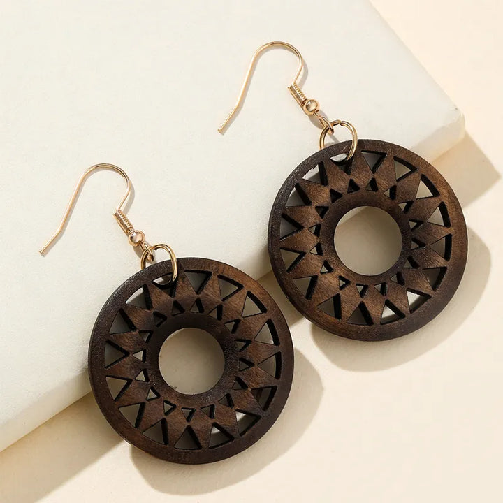 Organic retro carved wooden dangle earrings, unique handmade fashion accessory for women's style.