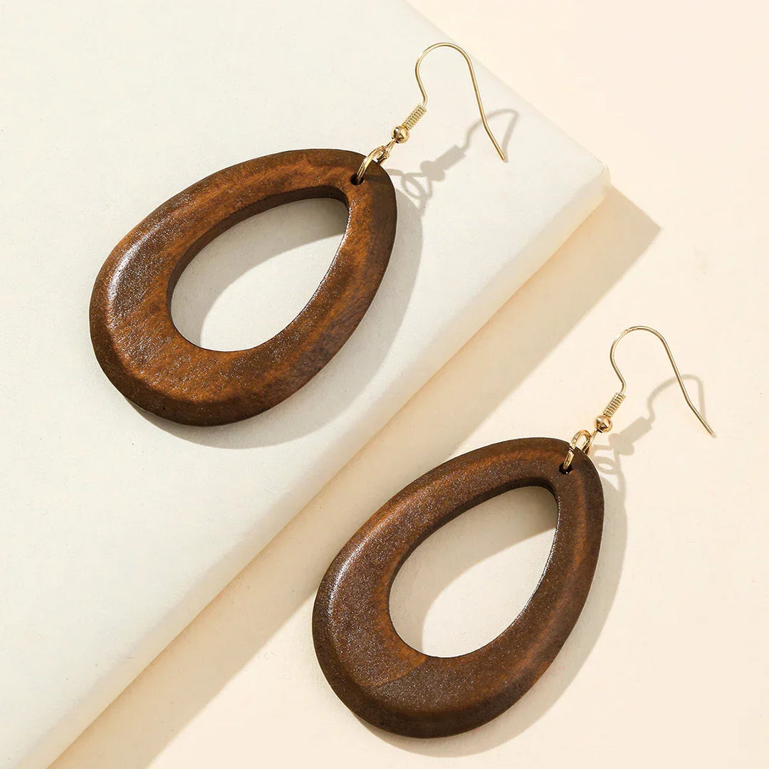 Timeless retro carved wooden dangle earrings, unique handmade jewelry for women with a vintage flair.