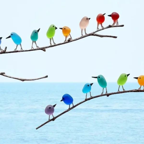 Elegant handmade sea glass bird sculpture, perfect as coastal wall art or ocean-inspired home decor.