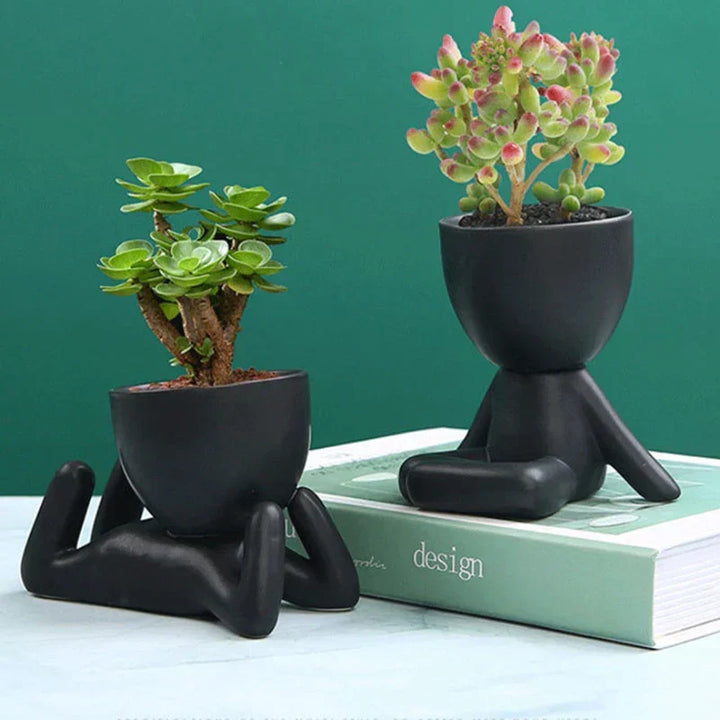 Handmade terracotta ceramic succulent planter with drainage hole, perfect for rustic indoor garden decor.
