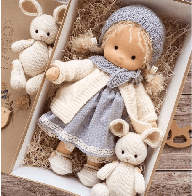 Children's handmade Waldorf doll, Poppi. Soft cuddle toy encourages imaginative play with natural materials.