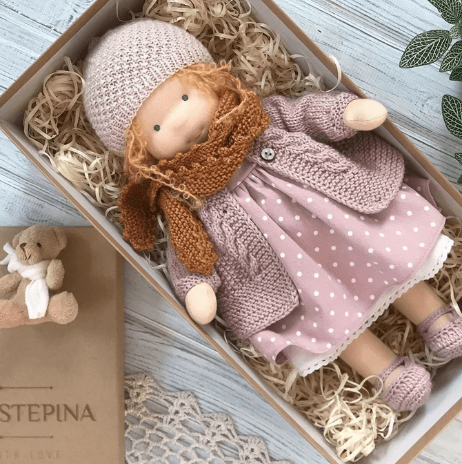 Poppi, a handmade Waldorf cuddle doll crafted from soft, natural materials for gentle comfort and play.