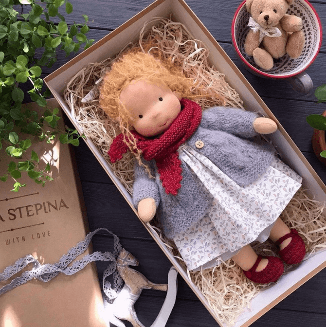 Poppi the Waldorf cuddle doll. Handmade children's plush toy from natural materials, perfect for comforting snuggles.