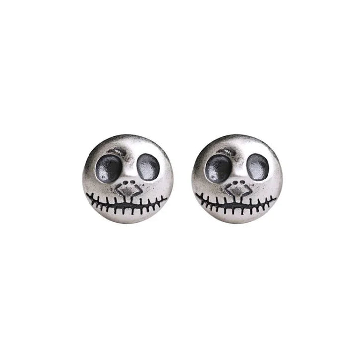 Handmade women's earrings featuring unique pumpkin skull design, perfect Halloween jewelry for a statement look.