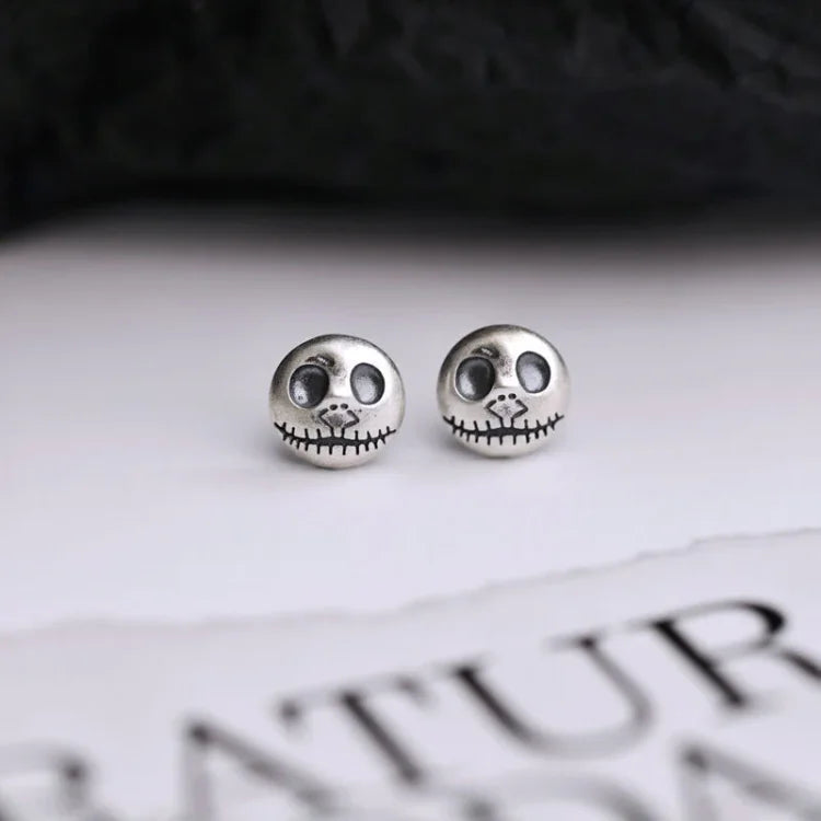 Unique women's Halloween statement earrings with handmade pumpkin & skull motifs, a spooky jewelry accessory.